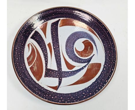 Alan Caiger-Smith (1930-2020) for Aldermaston Pottery, a pink and copper lustre charger, monograms, painted and incised marks