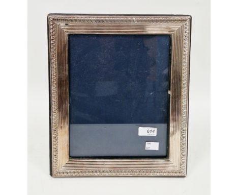 Large silver photograph frame, London 1992, Keyford Frames Ltd, having an embossed and reeded border, on a leather covered ea