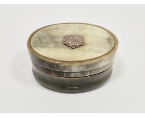 Horn and silver-mounted oval snuff or pill box, circa 1900, the cover applied with a silver shield-shaped plaque engraved wit