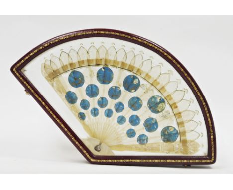 Regency pale horn brise fan&nbsp;having ten carved pierced sticks interset with chinoiserie decorated roundels on a blue grou