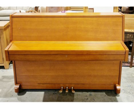 Contemporary Waldstein upright piano in a golden oak case, probably model no.UP108, on castors, 109cm high x 145.5cm long x 5