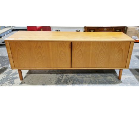 Mid-century teak sideboard, possibly by Austinsuite, comprising two tambour doors opening to three sections each with a fitte