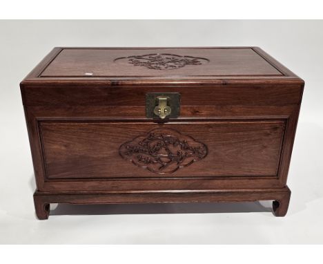 Chinese camphorwood blanket box, the hinged lid and front panel having a central relief carved decoration in the form of bird