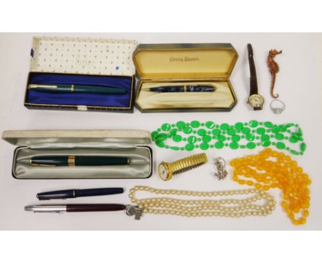 Two cased Parker fountain pens, another Parker fountain pen, Conway Stewart propelling pencil and a Scripto fountain pen toge
