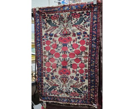 Small Persian rug, 20th century, woven with vases of pink flowers, parrots and blue and pink foliate borders, 121cm x 80cm&nb