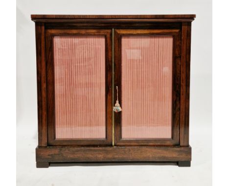 Regency rosewood dwarf library bookcase/chiffonier, the rectangular top with rounded corners, over two glazed panel doors enc