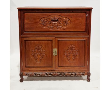 Chinese hardwood cocktail cabinet&nbsp;having carved leaf and vine decoration, the top with hinged lid and drop-down front, o