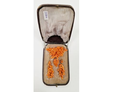 Victorian coral brooch and earring suite, carved in the form of flower and foliage bouquets, the brooch on a yellow metal wir