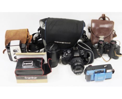 Collection of three cameras including Olympus E-410 camera with lens in soft case, Kodak Brownie Reflex 20 camera in case and