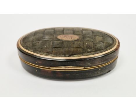 Tortoiseshell and gilt-metal mounted oval snuff-box and cover, 18th century, the cover moulded with basketwork, inset with ov