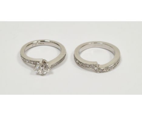 Platinum solitaire diamond ring, the brilliant cut round stone 0.72ct, colour F, clarity VS2, the shoulders set numerous tiny
