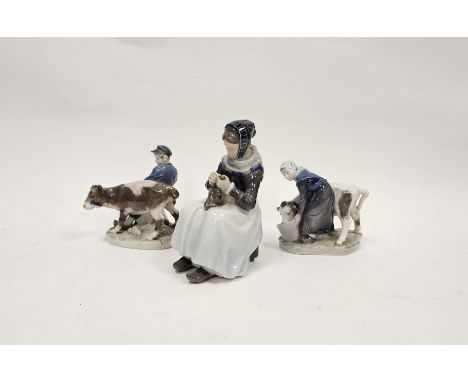Royal Copenhagen porcelain figure of The Knitter, shape no. 1317, a figure of a Girl Feeding a Calf, shape no. 779, and a Boy