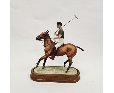 Royal Worcester equestrian figure of H.R.H. The Duke of Edinburgh, on a polo pony modelled by Doris Lindner, on a wooden stan