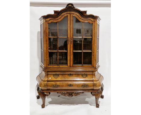 Walnut vitrine cabinet&nbsp;on chest in the 18th century Dutch manner, with shell carved and shaped moulded pediment, over tw