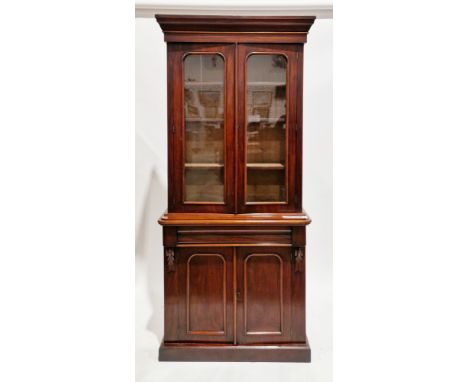 Victorian mahogany library bookcase, the moulded pediment over two glazed doors opening to three adjustable shelves, over a c