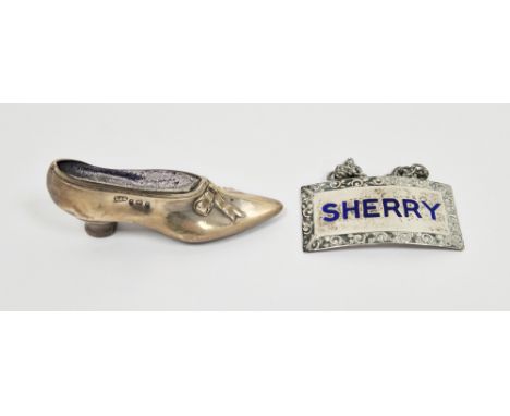 Edward VII silver pincushion in the form of a shoe, Birmingham 1904, Levi &amp; Salaman, 7cm long together with a silver and 