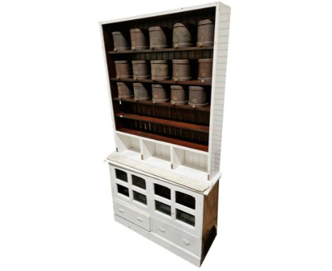 Victorian pine shop fitting cabinet, mostly painted white, the upper section with moulded cornice over three display sections