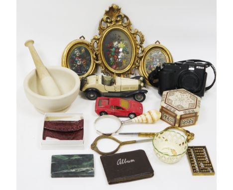 Mixed lot of collectable items including a Nikon Coolpix P7000 camera, a Concorde pewter desk weight, perspex desk ornaments 
