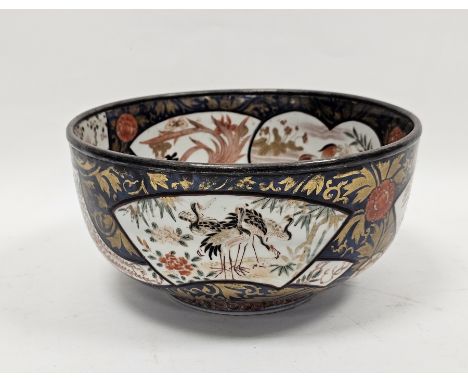 Japanese imari silver-mounted bowl, Edo period, painted with a vase of flowers before terracing to the centre, within fan-sha