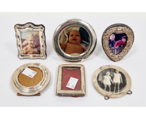 Collection of six small silver framed easel back photograph frames&nbsp;including a heart-shaped frame with embossed decorati