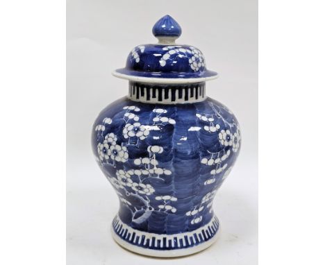 Chinese porcelain blue and white prunus pattern baluster vase and cover, four-character Kangxi mark to base, Qing Dynasty, pa