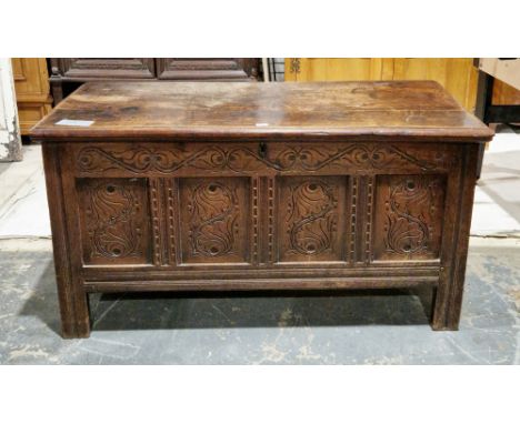 18th century oak coffer, the hinged lid with thumb-mould edge opening to a candle space, over a later carved four-panel front