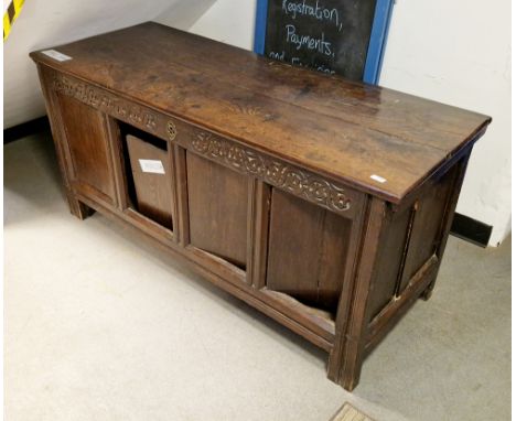 18th century oak coffer, having a hinged lid over a four panel fronted, the panels converted to hinged doors, on stile legs, 