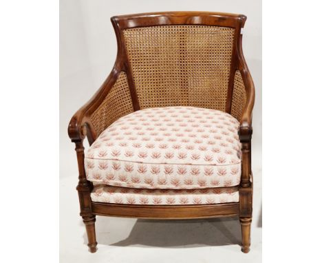 Wesley Barrell contemporary double cane bergere and stained hardwood armchair&nbsp;with a cream upholstered and pink floral p