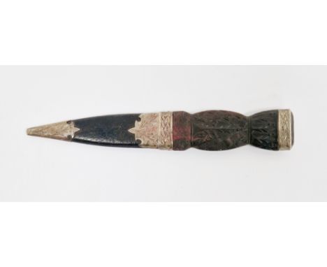 Silver mounted Scottish sgian dubh, the handle carved with thistles, with leather scabbard, the silver engraved with celtic k