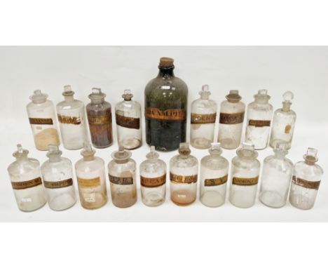 Collection of late 19th and early 20th century labelled glass apothecary jars and assorted stoppers, the majority labelled in