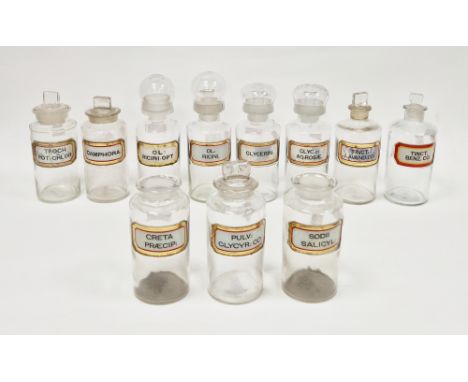 Ten early 20th century 'label under glass' apothecary bottles and assorted stoppers and stopper-droppers and another mid-20th
