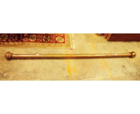 Late 19th / early 20th century gilt metal cylindrical curtain rail with globular end finials, 213cm long  Provenance: from th