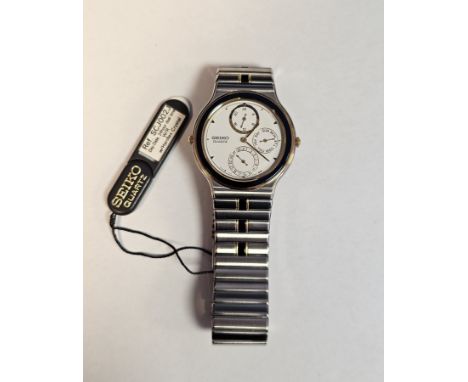 Seiko stainless steel day/date 24 hour dual time wristwatch, having dot numerals, three subsidiary dials, all with blue and w