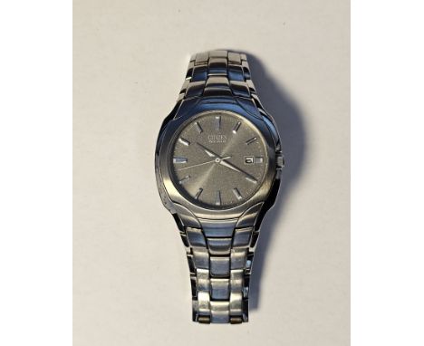 Gent's Citizen Eco-drive stainless steel bracelet watch, the circular grey dial with date aperture, in original case and with