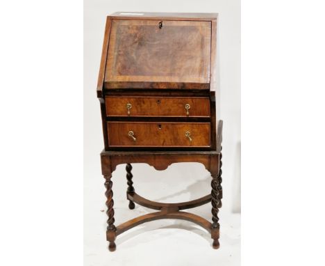 Walnut and walnut-veneered bureau in the Queen Anne manner, of small proportions, the sloping front opening to a fitted inter