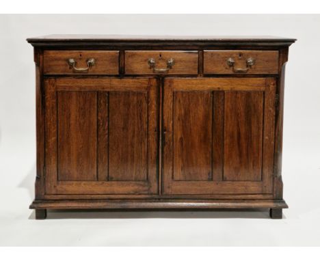 George III oak dresser base, possibly from North Wales, the rectangular top with thumbmould edge, over three frieze drawers w
