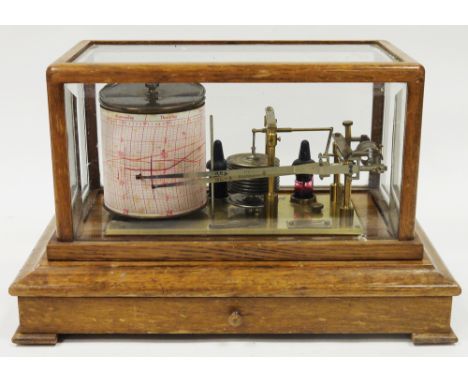 Early 20th century Negretti &amp; Zambra oak cased barograph, with lacquered brass mechanism and bevelled glass panels to lif