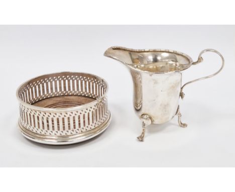 George V silver cream jug Birmingham 1935 having bead and reel border, S-scroll handle and raised on three tab feet 3ozt and 