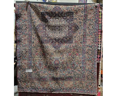 20th century silk Persian rug, the centre with a large radiating foliate medallion in blue, pink and ivory, on an ivory groun