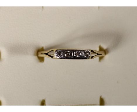 An 18ct gold four stone diamond ring, 1.9gm, R 