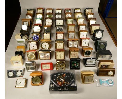 A collection of travel alarm clocks to include, an Elvis Presley alarm clock, Kundo mega quartz, Europa 7 jewels, Empora 2 je