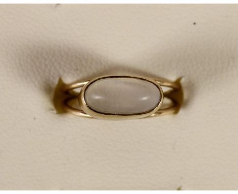 A 9ct gold and moonstone dress ring, stamped 9ct, 11 x 6mm, 2 gm, K. 