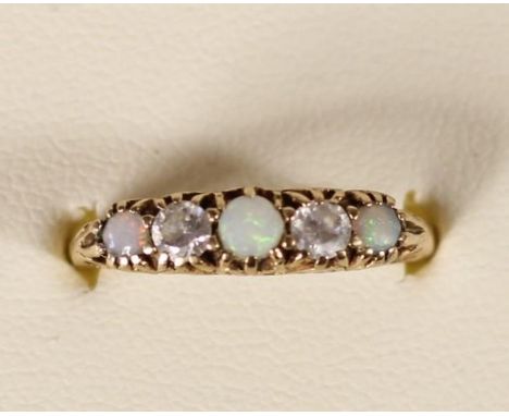 A 9ct gold opal and CZ five stone ring, 1.7gm, Q 1/2. 