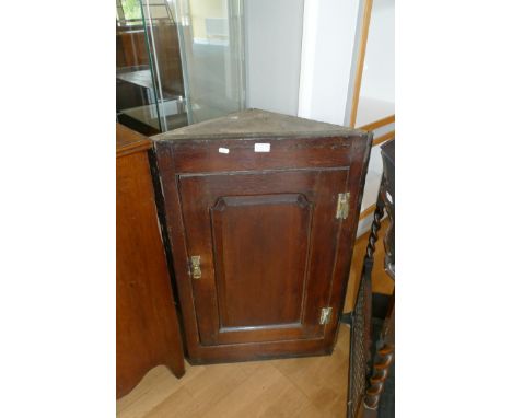 A Victorian oak corner cabinet with a single shelf and brass fitting, H-90cm, W-64cm, D-37cm, together with an Edwardian book