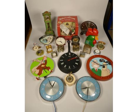 A collection of clocks to include, a Mickey Mouse alarm clock, a Wallace and Gromit talking radio alarm clock (boxed), a Kell