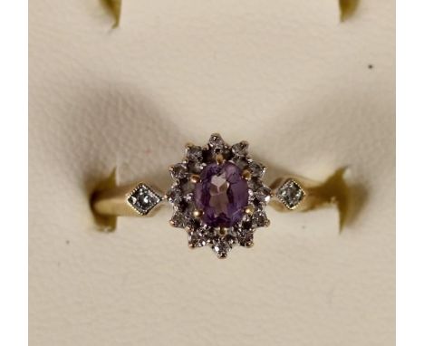 A 9ct gold, amethyst and diamond cluster ring, 1.9 gm, M 1/2. 