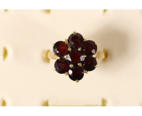 A 9ct gold and garnet cluster ring, 3.3gm, R