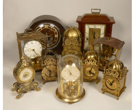 A collection of clocks to include, brass lantern clocks, Kern anniversary clock, Franz Hemle &amp; John manual wind clock and