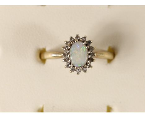 A 9ct gold opal and diamond cluster ring, 2.7gm, O.