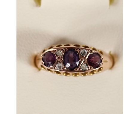 An Edwardian 9ct rose gold amethyst and paste ring, Chester 1907, 1.9gm, P. 